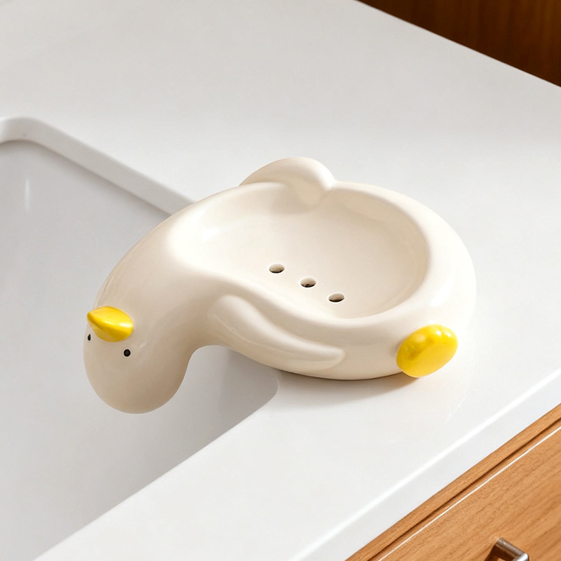 Suport ceramic pentru săpun în formă de rață, cu drenaj, pentru baie