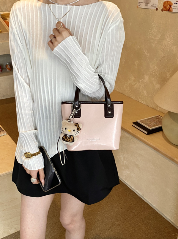 Nova nišna luksuzna ženska torbica, visokokvalitetna torba za nošenje preko ramena, Kelly torba, svestrana crossbody torba, moderna i trendi