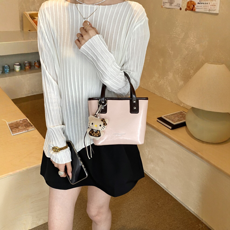 Nova nišna luksuzna ženska torbica, visokokvalitetna torba za nošenje preko ramena, Kelly torba, svestrana crossbody torba, moderna i trendi
