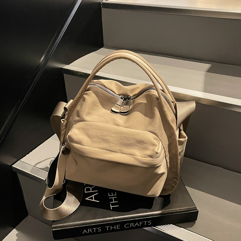 Ženska lagana crossbody torbica od Oxford tkanine, kompaktna, gradski casual stil
