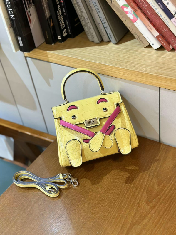Kelly torbica sa smiješnim licem, novi model 2026, teksturirana mini torba s uzorkom krokodila, svestrana i slatka, za ramena ili crossbody