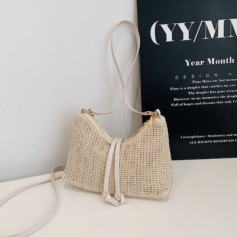 Ženska torbica od pletene trave – lagana, jednobojna, s ramenskim remenom (crossbody), minimalistički stil, 2026