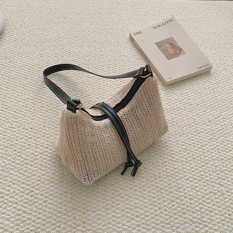 Ženska torbica od pletene trave – lagana, jednobojna, s ramenskim remenom (crossbody), minimalistički stil, 2026