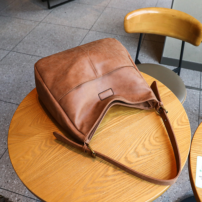 Ženska torba velike kapacitete, crossbody torba tip kanta, 2026 novi model s retro teksturom