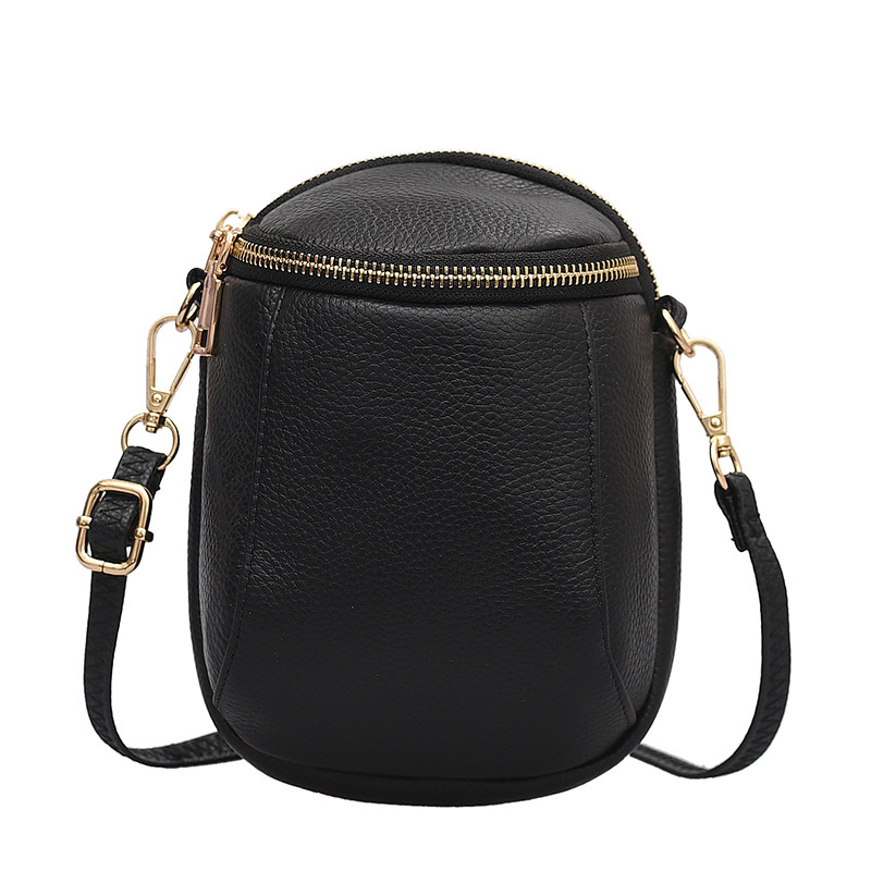 Ženska mini torbica od prave kože, vertikalnog dizajna, crossbody s kaišem, model 2025