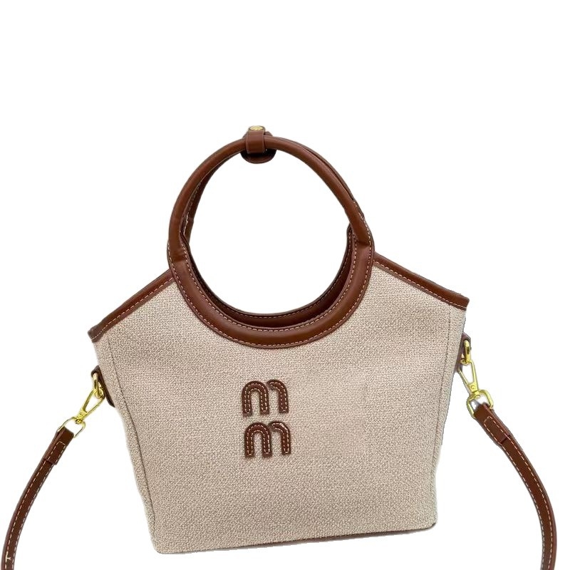 Nova moderna torba s kontrastnim bojama, velika kapaciteta za svakodnevnu upotrebu — bucket bag stil s jednim remenom