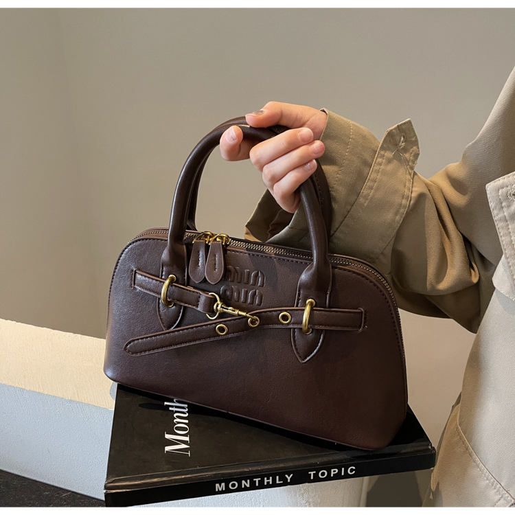 Premium ženska torba Boston, retro stil, dnevna torba za svakodnevnu upotrebu, nišni dizajn, može se nositi u ruci ili preko ramena.