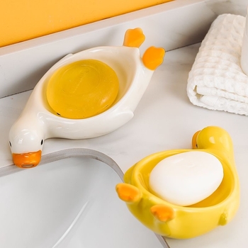 Sapunieră ceramică în formă de rață galbenă, cu drenaj, pentru baie