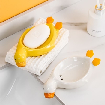 Sapunieră ceramică în formă de rață galbenă, cu drenaj, pentru baie