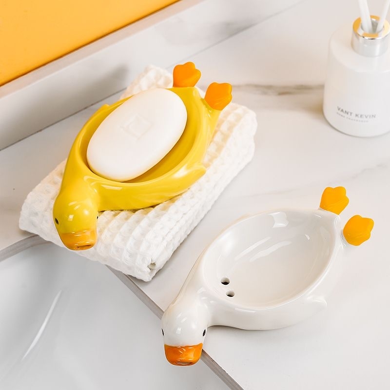 Sapunieră ceramică în formă de rață galbenă, cu drenaj, pentru baie