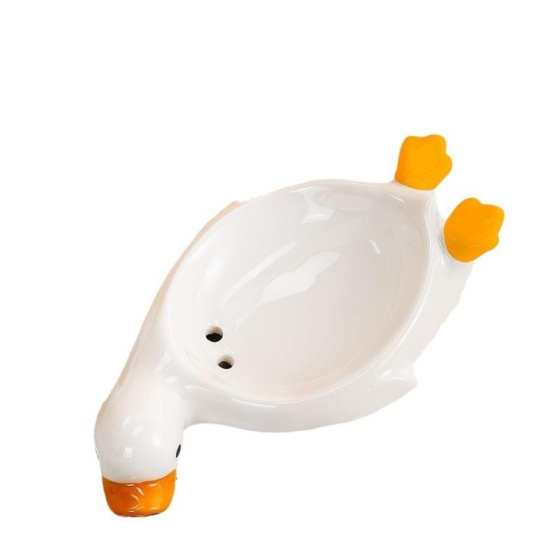 Sapunieră ceramică în formă de rață galbenă, cu drenaj, pentru baie
