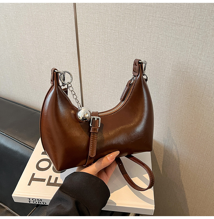 Ženska torbica od vosk kože, mala polukružna forma, crossbody torbica s jednim remenom
