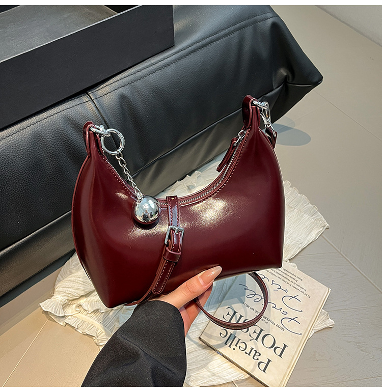 Ženska torbica od vosk kože, mala polukružna forma, crossbody torbica s jednim remenom