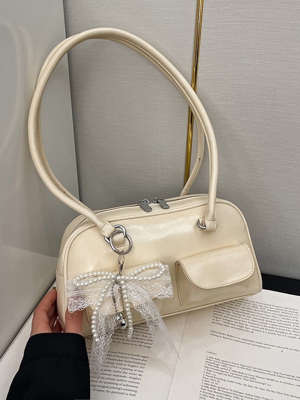 Ženska baguette torba s nišnim dizajnom ispod pazuha, korejski stil, ljeto 2025, svestrana i elegantna torba za svakodnevno nošenje