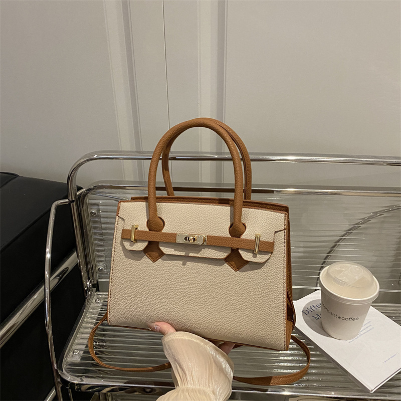 Ženska torbica u korejskom stilu Kelly, minimalistična tekstura, novi model jesen 2025, nišni dizajn, svestrana crossbody torba