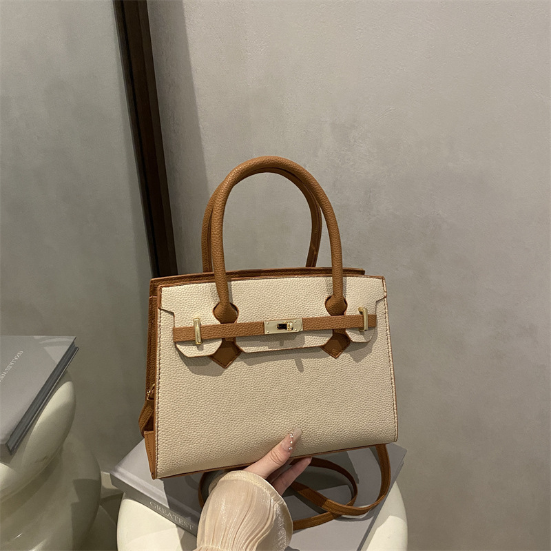 Ženska torbica u korejskom stilu Kelly, minimalistična tekstura, novi model jesen 2025, nišni dizajn, svestrana crossbody torba