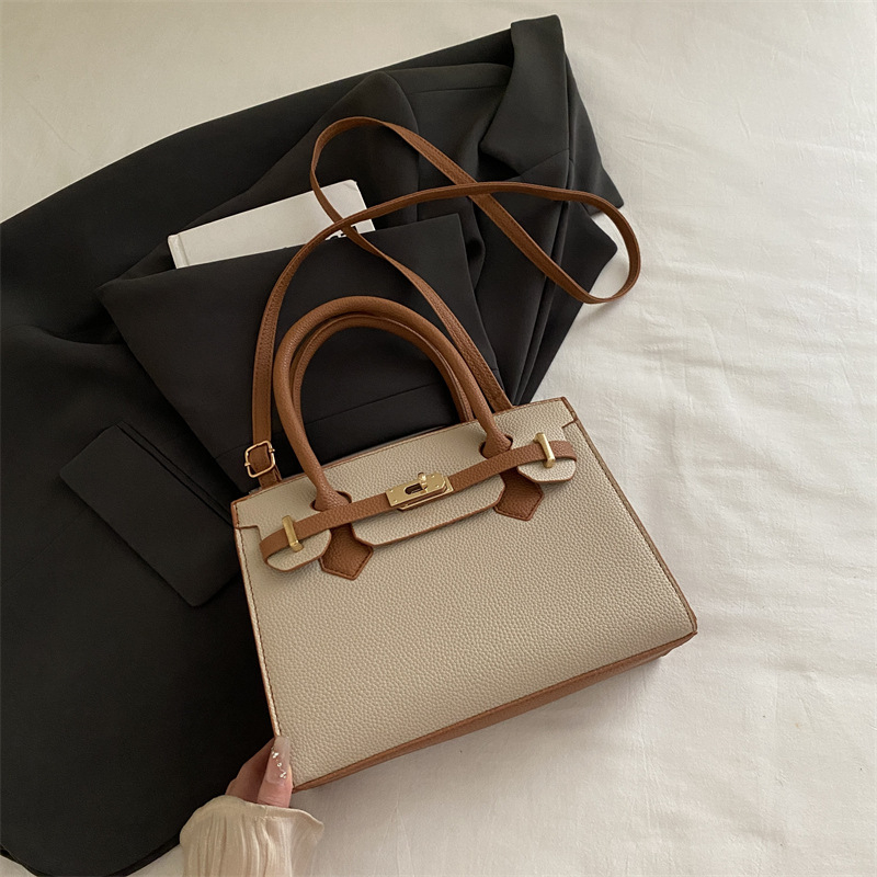 Ženska torbica u korejskom stilu Kelly, minimalistična tekstura, novi model jesen 2025, nišni dizajn, svestrana crossbody torba