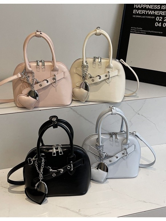 Ružičasta otmjena mala torbica Kelly stila za žene s ručkom i crossbody remenom, 2025 novi model, lagani luksuz, nišni dizajn, visoka kvaliteta