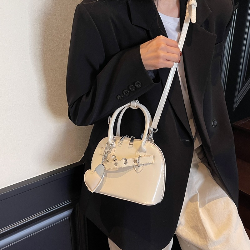Ružičasta otmjena mala torbica Kelly stila za žene s ručkom i crossbody remenom, 2025 novi model, lagani luksuz, nišni dizajn, visoka kvaliteta