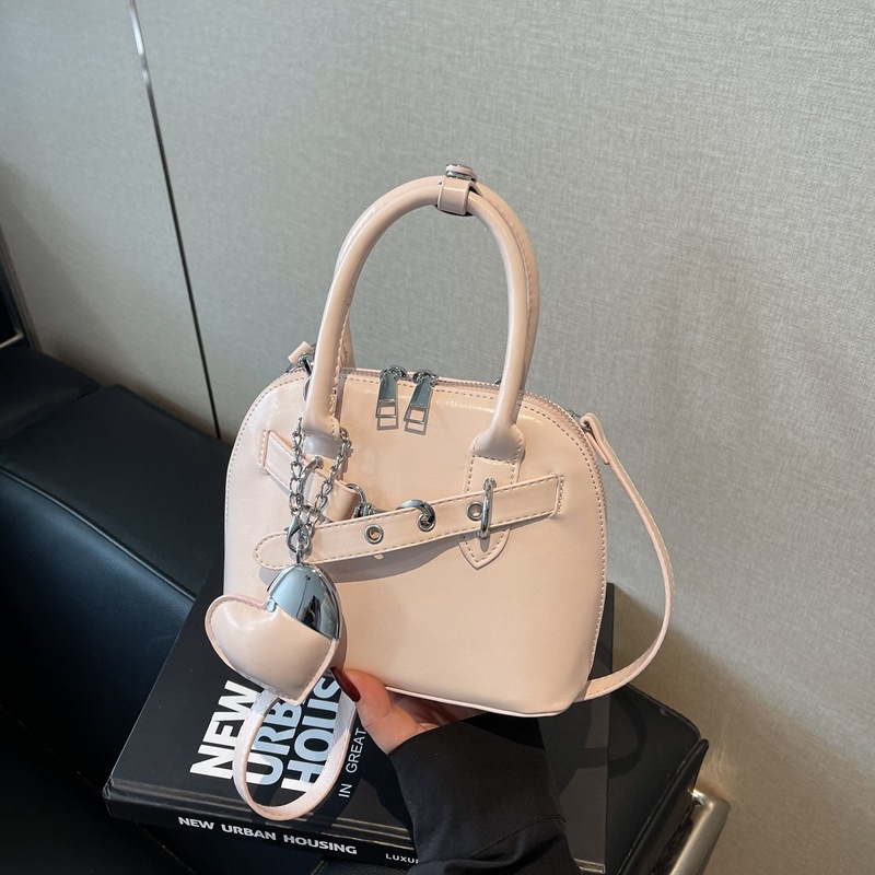 Ružičasta otmjena mala torbica Kelly stila za žene s ručkom i crossbody remenom, 2025 novi model, lagani luksuz, nišni dizajn, visoka kvaliteta