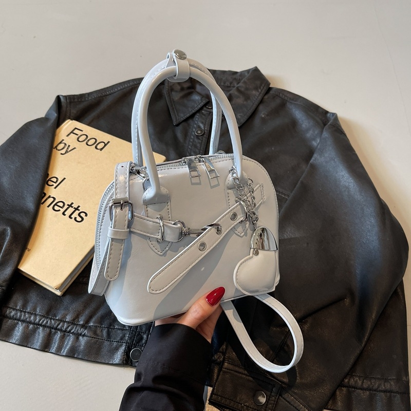 Ružičasta otmjena mala torbica Kelly stila za žene s ručkom i crossbody remenom, 2025 novi model, lagani luksuz, nišni dizajn, visoka kvaliteta