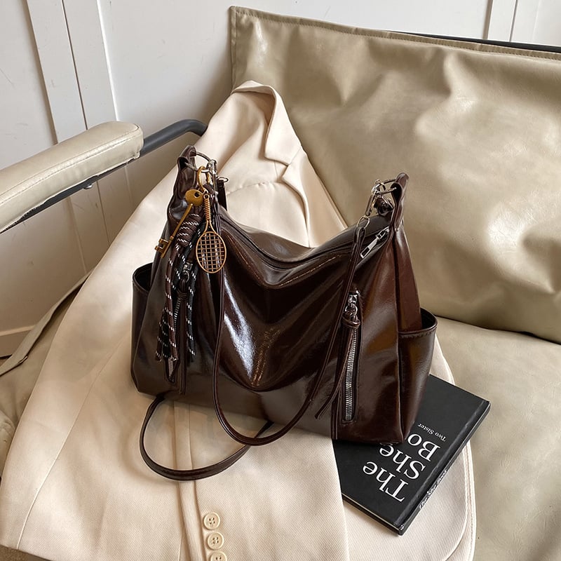 Ženska torba velikog kapaciteta s širokim remenom, crossbody/tote stil, proljeće-ljeto 2025.
