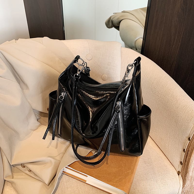 Ženska torba velikog kapaciteta s širokim remenom, crossbody/tote stil, proljeće-ljeto 2025.