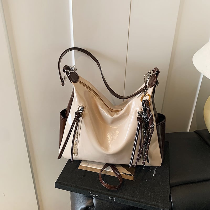 Ženska torba velikog kapaciteta s širokim remenom, crossbody/tote stil, proljeće-ljeto 2025.