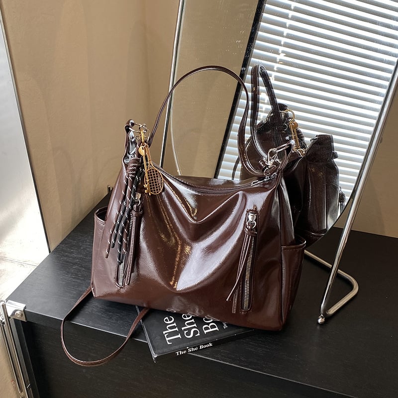 Ženska torba velikog kapaciteta s širokim remenom, crossbody/tote stil, proljeće-ljeto 2025.