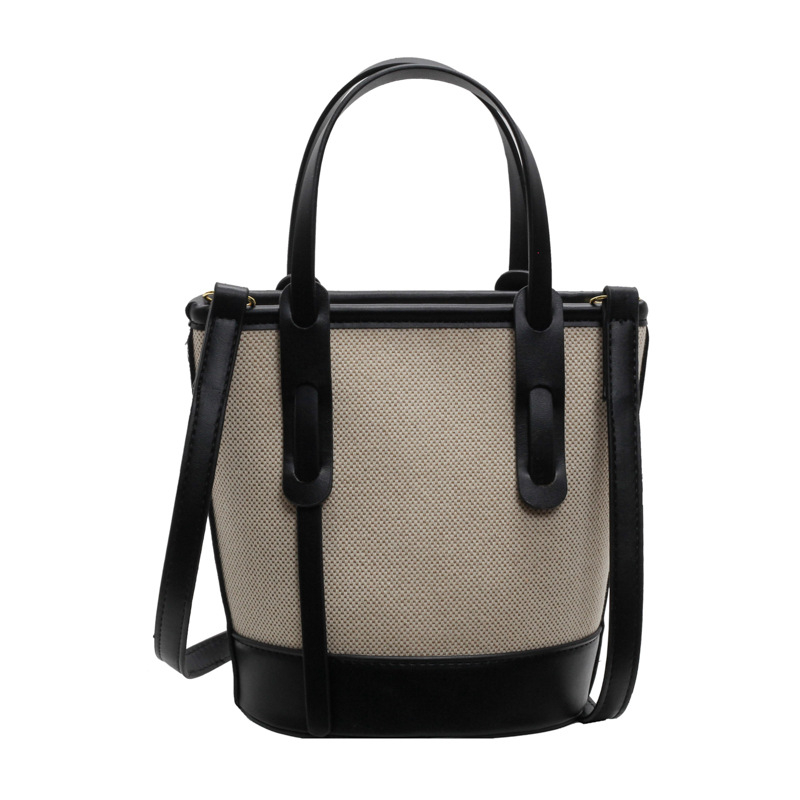 Ženska bucket torba s kontrastnim blokovima boja, model 2026, s jednim remenom za rame i crossbody, minimalistička elegantna svakodnevna torba