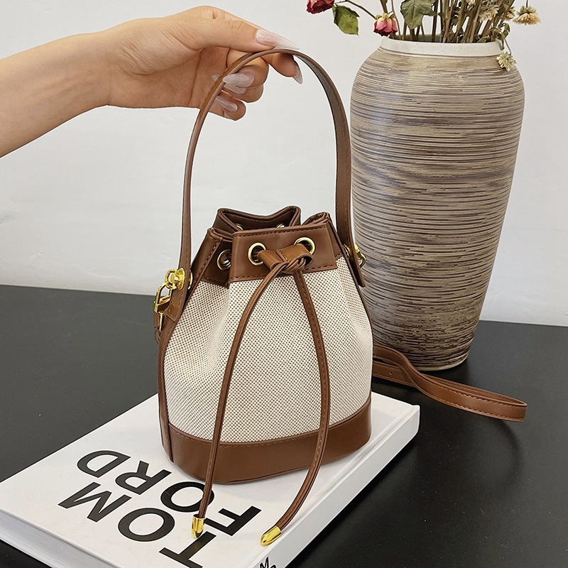 Ženska PU bucket torba s vrpcom za zatvaranje, mala, preko ramena ili crossbody, u kontrastnim bojama