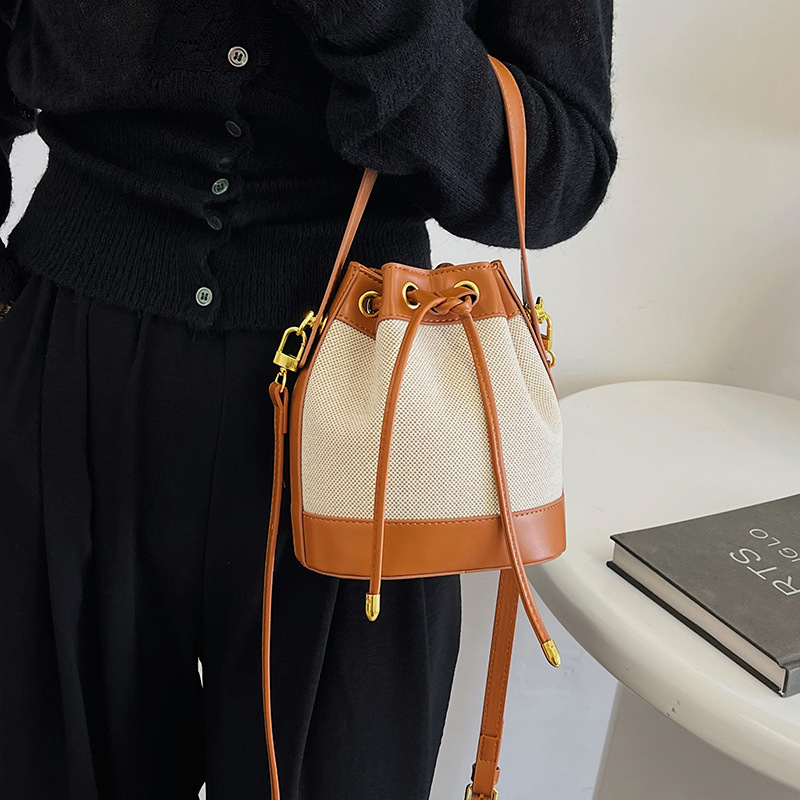 Ženska PU bucket torba s vrpcom za zatvaranje, mala, preko ramena ili crossbody, u kontrastnim bojama