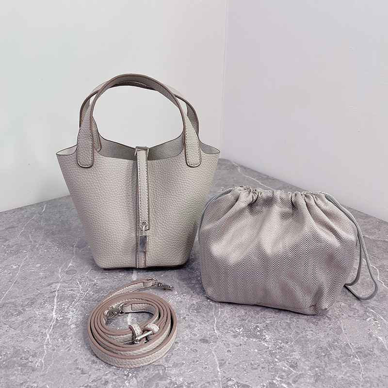 K-stil bucket torbica s lychee teksturom za žena, mini crossbody, model 2025, modnog visokog razreda