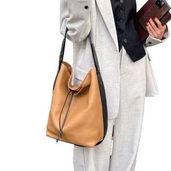 Bucket bag, ležernog stila, inspirirano korejskom modom, minimalistički dizajn, umjetnička torba preko ramena.