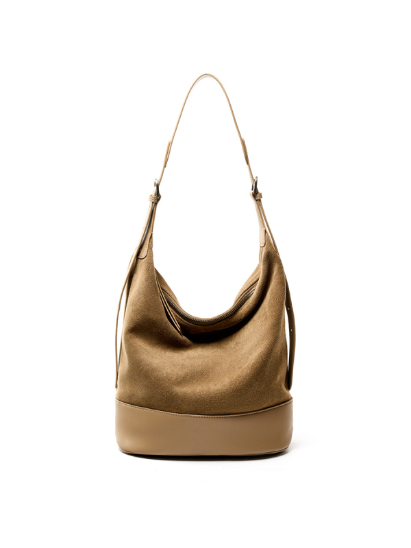 Ženska torbica od prave kože, bucket bag, preko ramena, srednje veličine, moderan gradski stil.