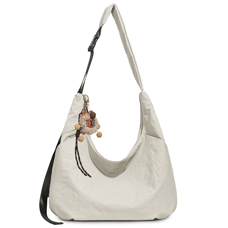 Ženska crossbody torbica u obliku polumjeseca, dumpling stil, Oxford tkanina, proljeće 2026