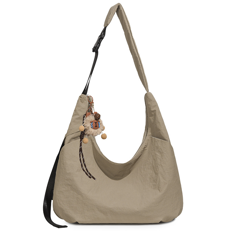 Ženska crossbody torbica u obliku polumjeseca, dumpling stil, Oxford tkanina, proljeće 2026