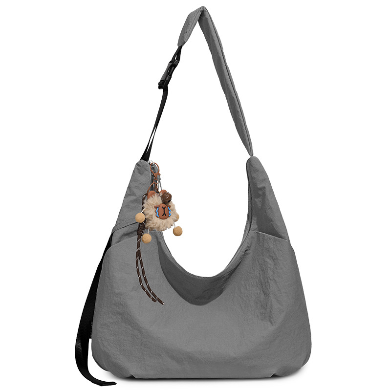 Ženska crossbody torbica u obliku polumjeseca, dumpling stil, Oxford tkanina, proljeće 2026