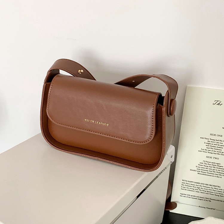 Ženska crossbody torbica, lagani luksuz, PU koža, srednja veličina, kvadratnog oblika, minimalistički stil, svakodnevna uporaba