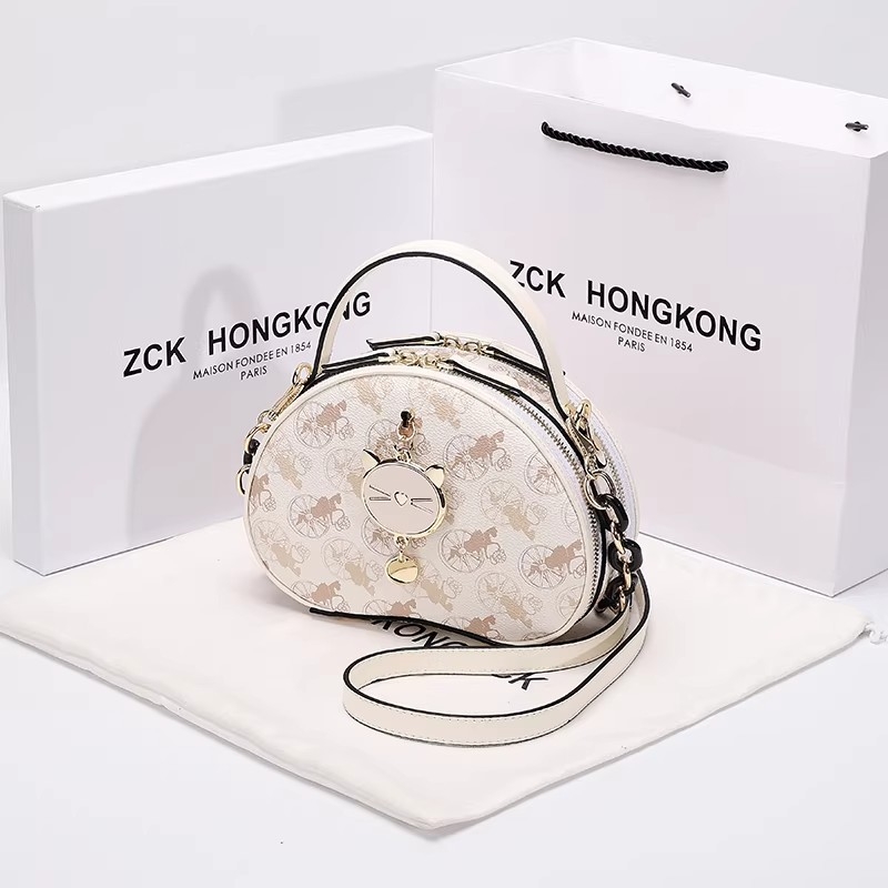 Prava kožna okrugla torbica s premium dojmom, svestrana ženska torba za rame/crossbody/ručno nošenje (Proljeće 2026)