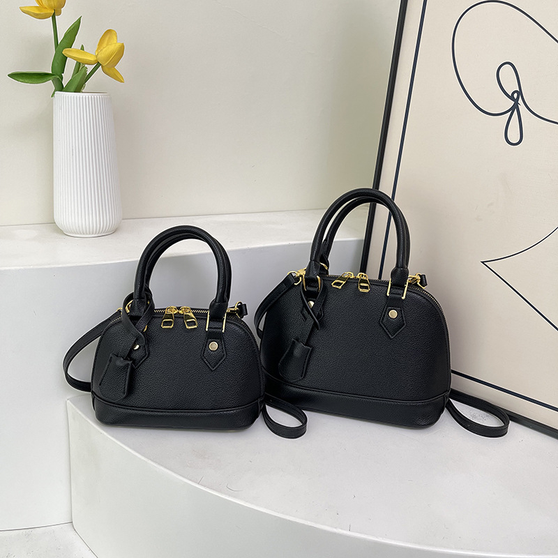 Ženska PU kožna crossbody torba u obliku školjke s lychee teksturom