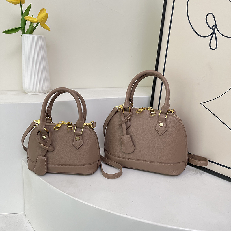 Ženska PU kožna crossbody torba u obliku školjke s lychee teksturom