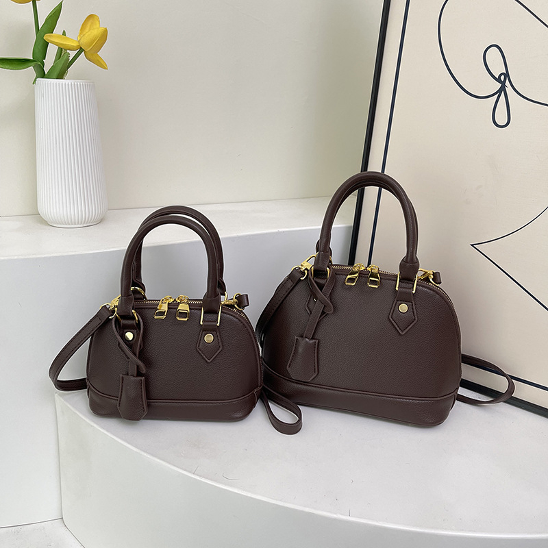 Ženska PU kožna crossbody torba u obliku školjke s lychee teksturom