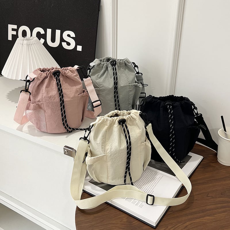 Stilna ženska crossbody torba s vezicom i bucket stilom, lagana i s velikim kapacitetom, za svakodnevnu upotrebu