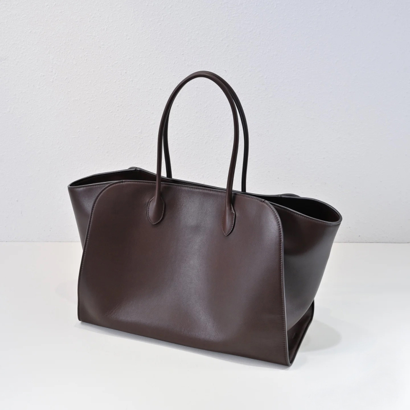 Minimalistička luksuzna kožna tote torba crne boje, s motivom krila, svakodnevna torba preko ramena