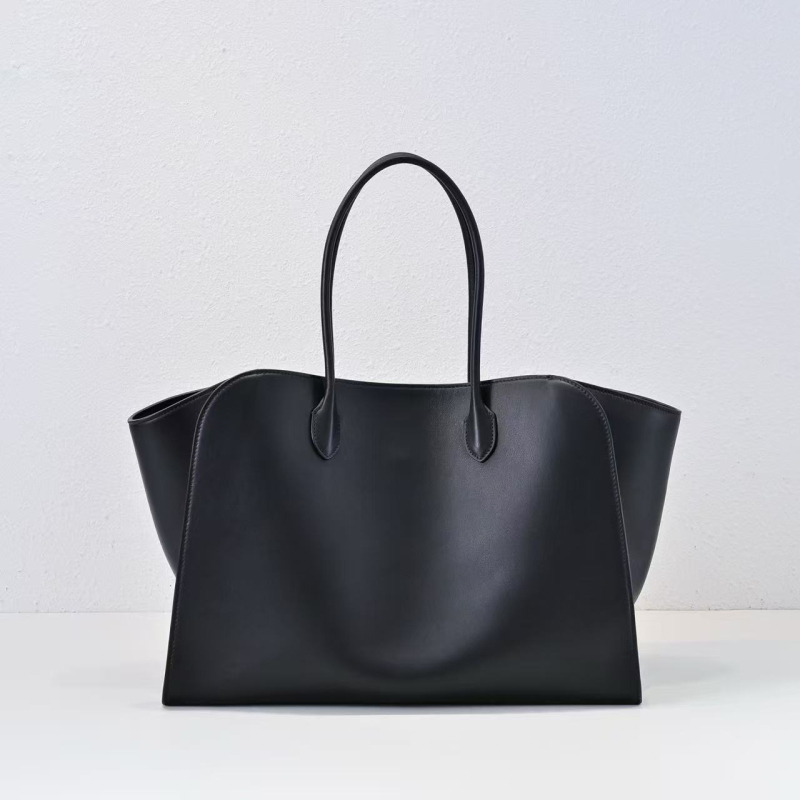 Minimalistička luksuzna kožna tote torba crne boje, s motivom krila, svakodnevna torba preko ramena