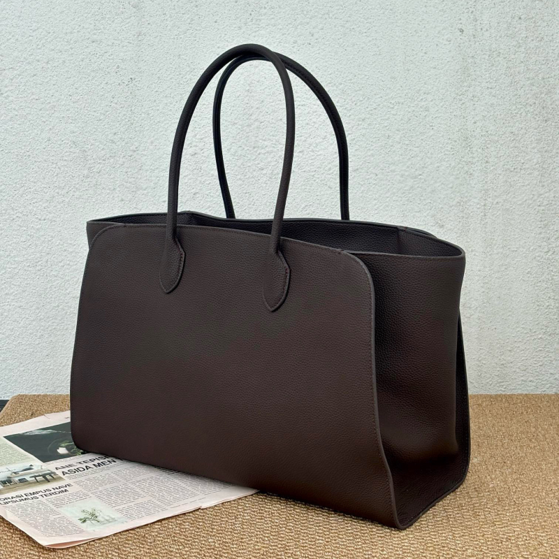 Minimalistička luksuzna kožna tote torba crne boje, s motivom krila, svakodnevna torba preko ramena