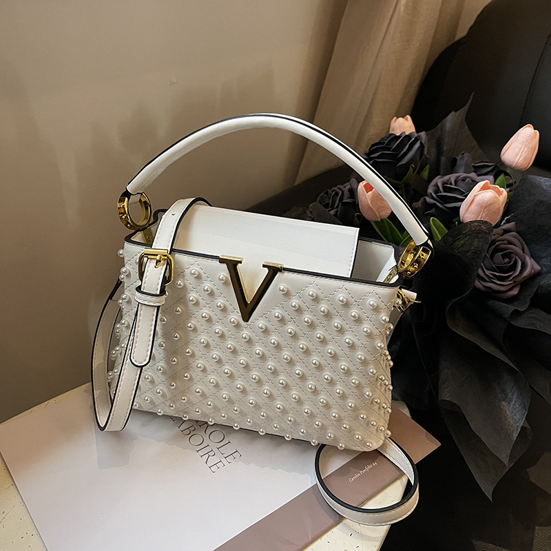 Ženska torbica s perlama, gradski minimalistički stil 2025, mala PU crossbody torbica s unutarnjim džepovima za telefon i ID.