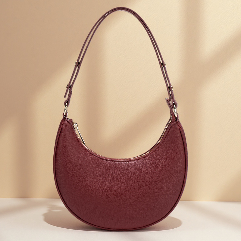 Ženska torba ispod pazuha, ljetna crossbody torba preko ramena, baguette torba u obliku polumjeseca, Instagram inspiracija, model 2026