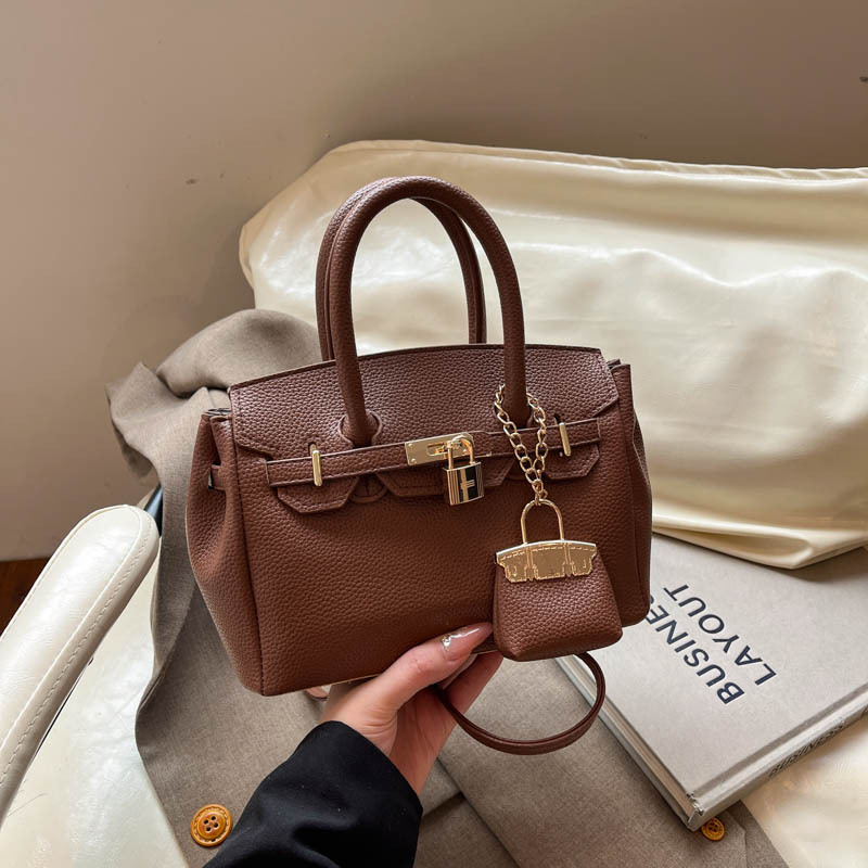 Jednobojna Kelly torba za svakodnevnu upotrebu, svestran gradski stil s jedinstvenim dizajnom
